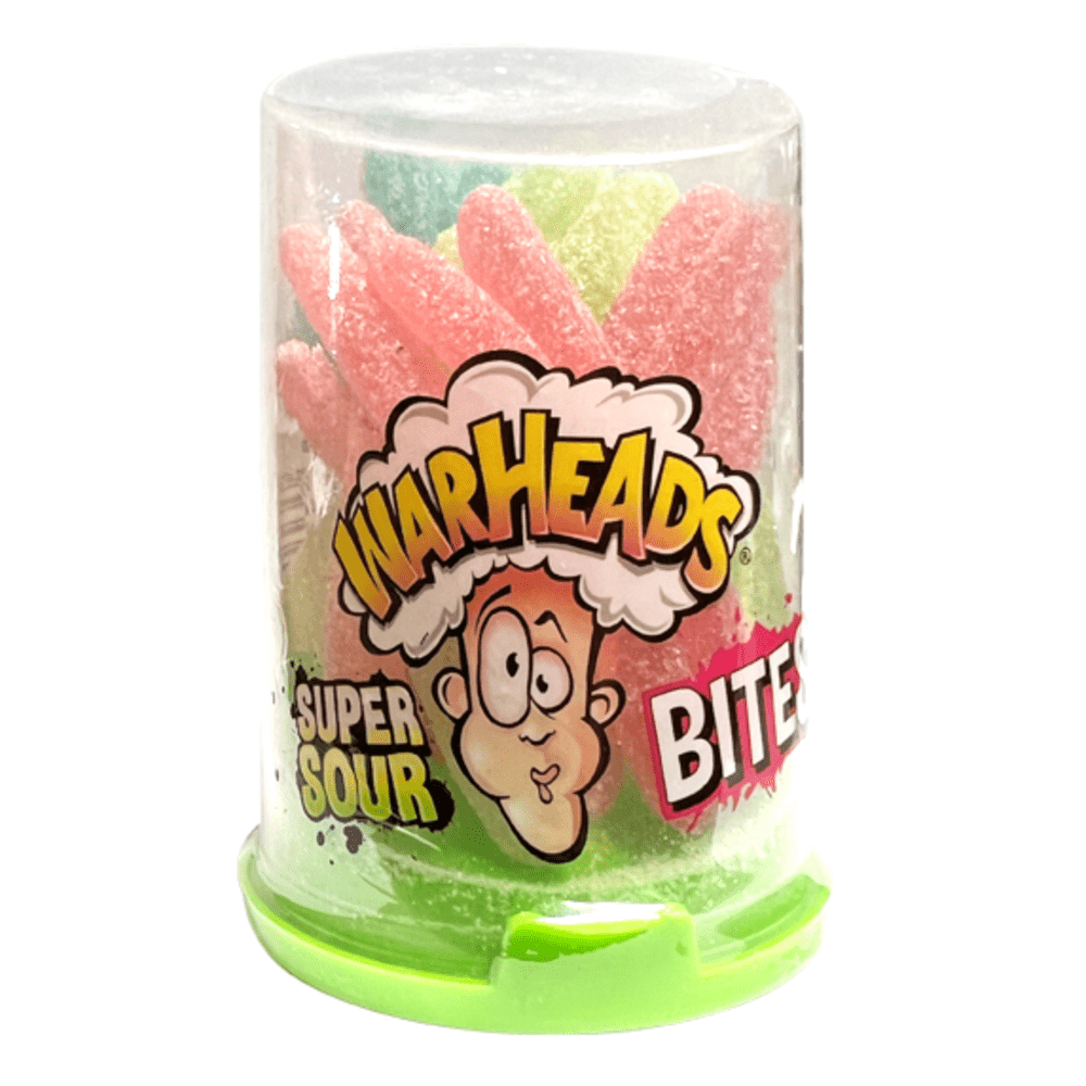 Un emballage vert sur fond blanc, un capuchon transparent avec un visage qui a la tête qui explose et  à l’intérieur il y a de longs bonbons rouges, jaunes et verts