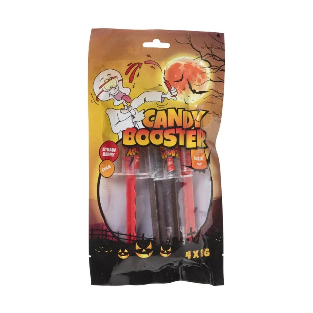 Sachet Candy Booster Halloween 4 x 8 g contenant des bonbons fraise et cola, présenté dans un décor avec citrouille illuminée.