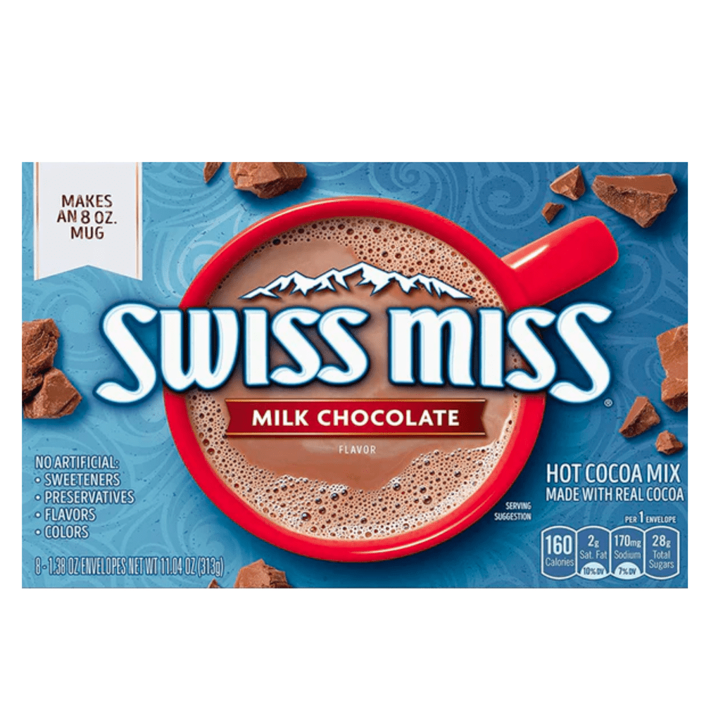 Un emballage bleu sur fond blanc avec une tasse rouge vue d’en haut, elle est remplie de cacao chaud et autour il y a des petits petits morceaux de chocolat 