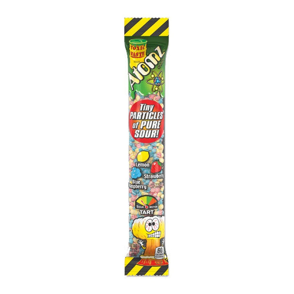 Toxic Waste Atomz Candy - My American Shop FranceUn emballage vert avec une partie transparente qui permet de voir des petites billes bleu, jaune et rouge. Le tout sur fond blanc